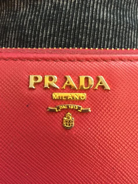 how to spot fake prada wallet|prada purse fake.